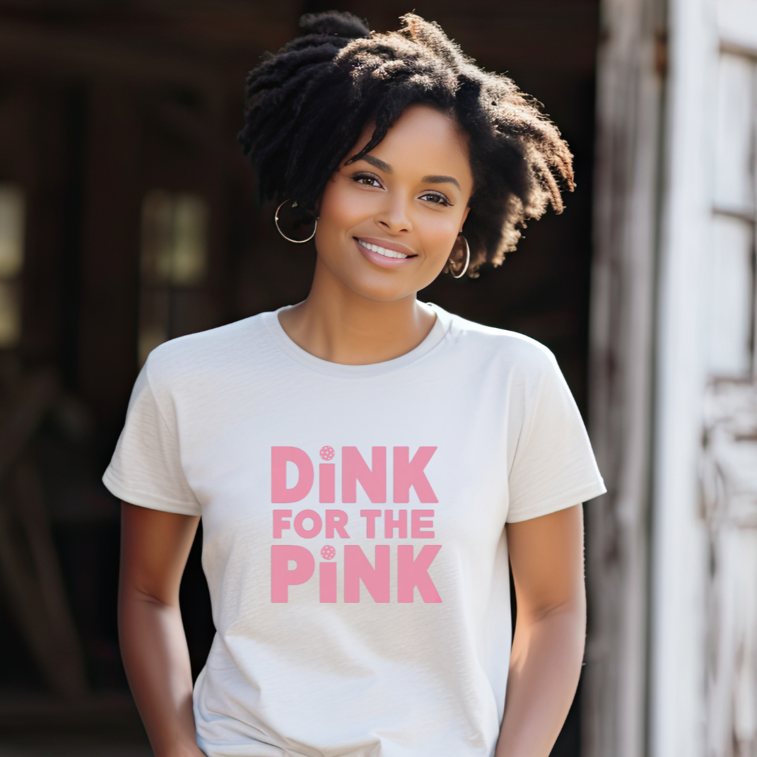 Woman_wearing_a_white_pickleball_t-shirt_that_says_dink_for_the_pink