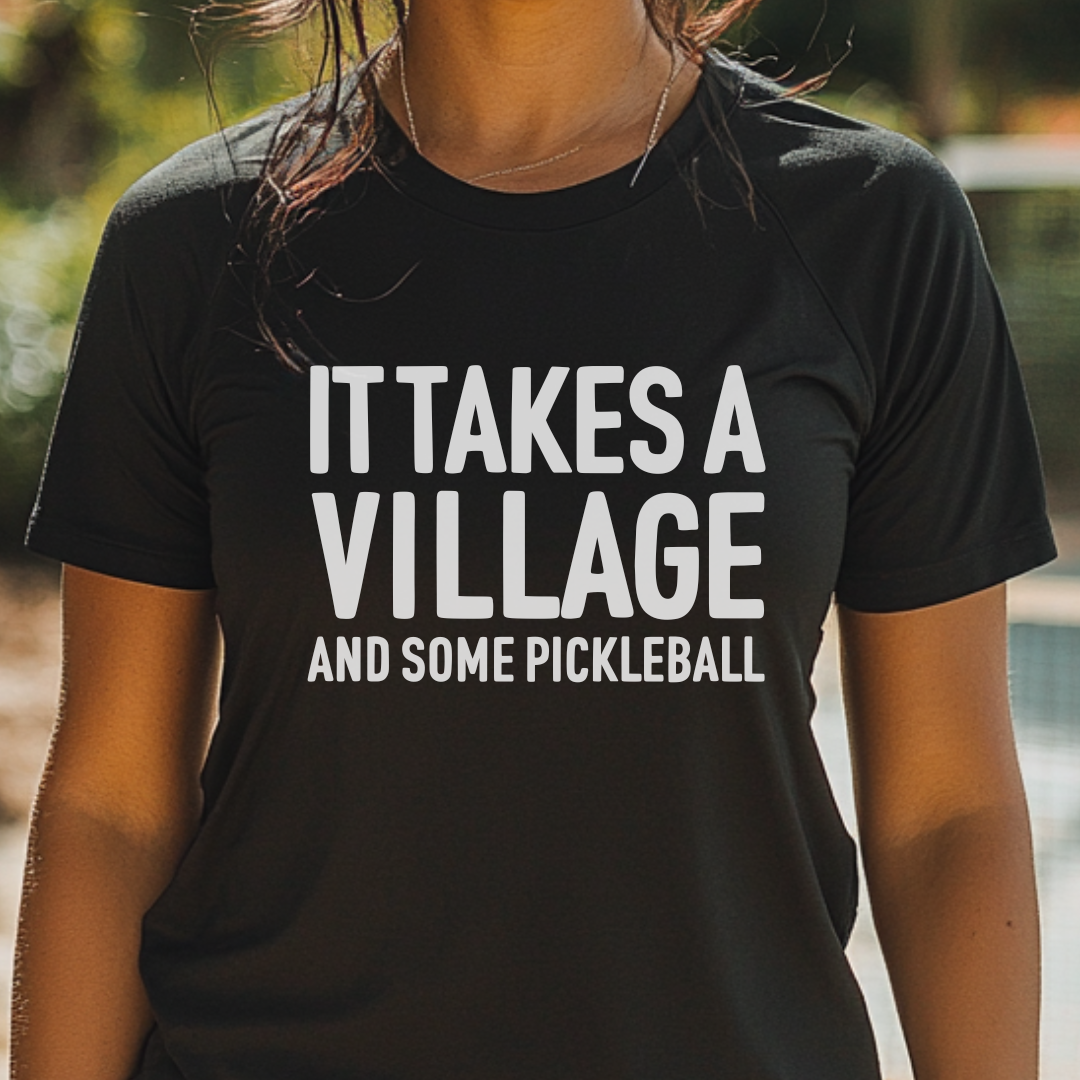 woman_in_black_it_takes_a_village_and_some_pickleball_tee
