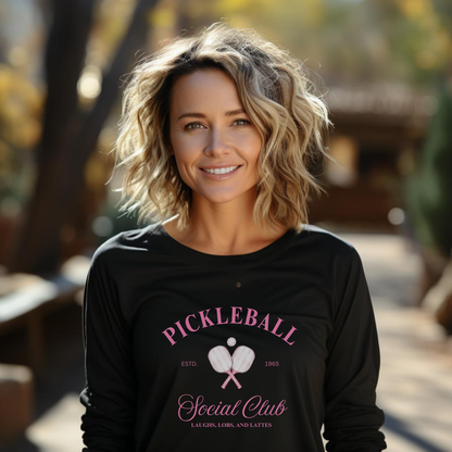 woman wearing a black long sleeve t-shirt that says pickleball social club