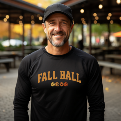 man wearing a black long sleeve fall ball pickleball t-shirt