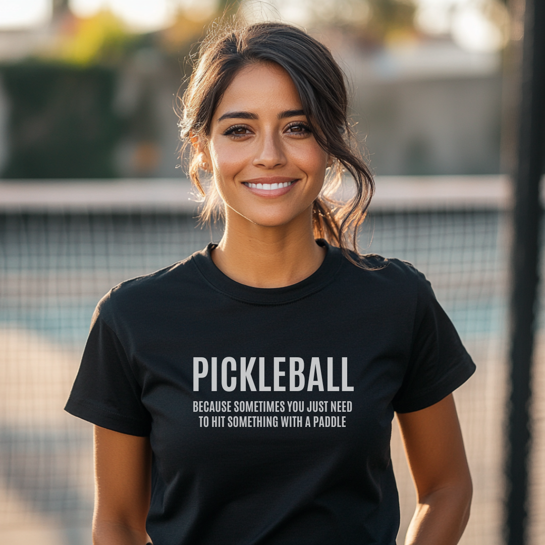 woman wearing a black short sleeve pickleball t-shirt